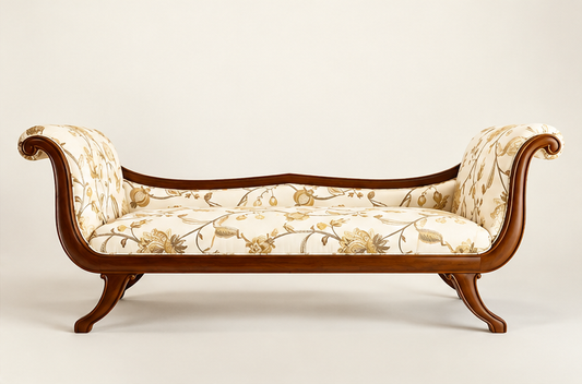 Front studio view of classic wooden upholstered couch with rolled arms and floral upholstery