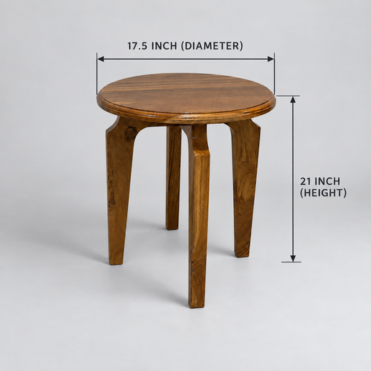 A small round wooden stool with three legs, shown on a light gray studio background.