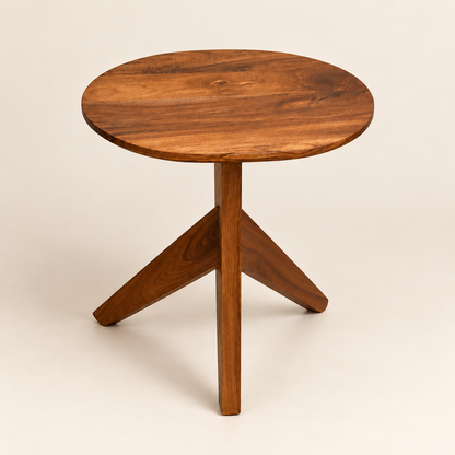 A round wooden side table with a three-star tripod base, made from rich medium-brown wood with visible grain patterns, photographed on a solid light beige background.