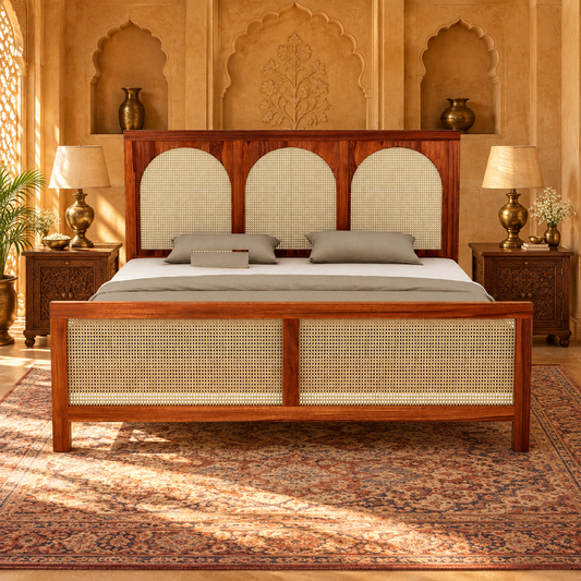 Arched Cane Panel Wooden Bed in teak wood — front view styled in bedroom