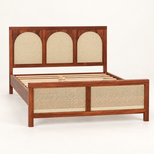 Arched Cane Panel Wooden Bed in teak wood — side studio view of bare frame