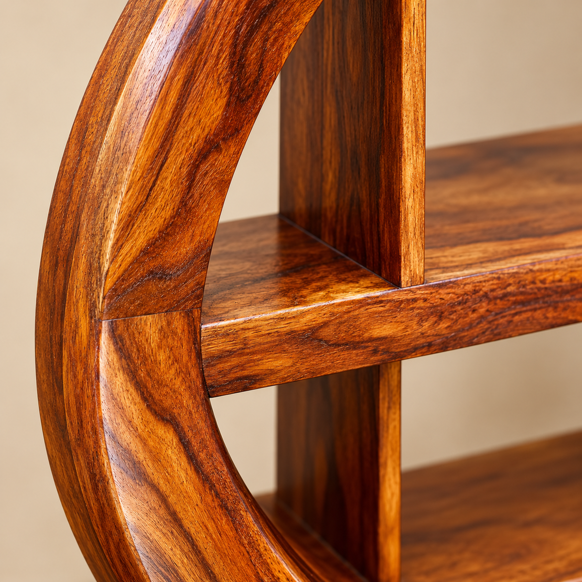 Close-up of Sheesham wood grain and curved bookshelf joinery