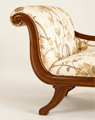 Close-up of classic upholstered couch floral fabric and curved teak wood craftsmanship