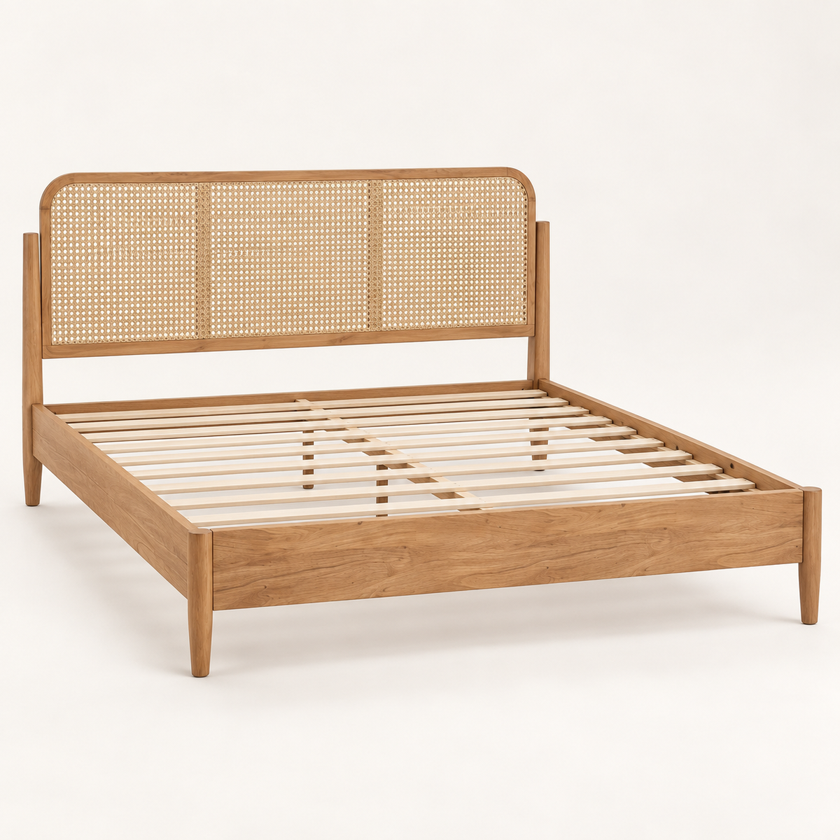 Light Wood Cane Bed in teak wood — side studio view of bare frame