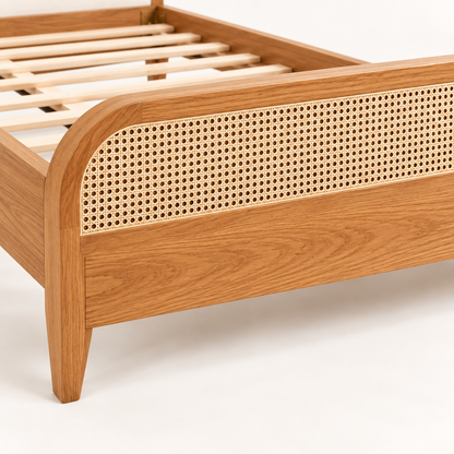 Rounded Cane and Leatherette Bed in teak wood — close-up of footboard