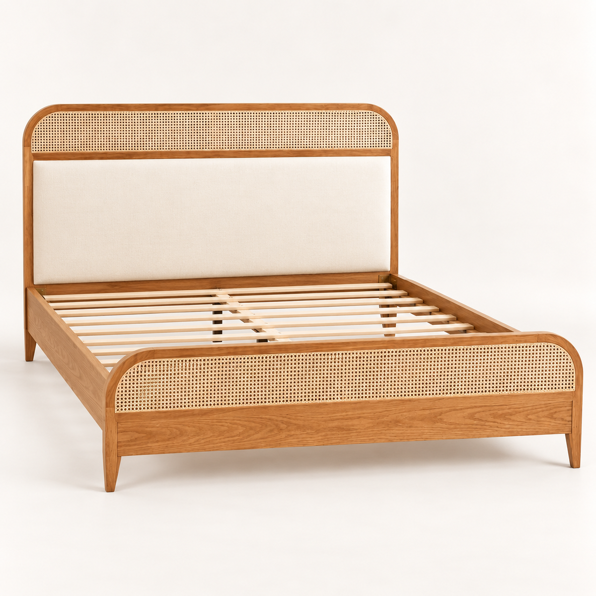 Rounded Cane and Leatherette Bed in teak wood — side studio view of bare frame