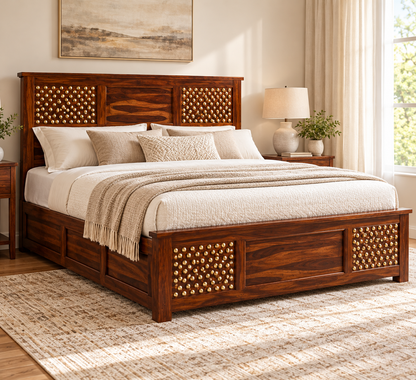 Side lifestyle view of dark walnut brass-studded bed with mattress